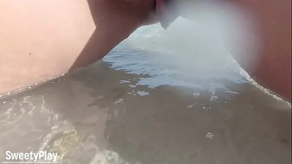 Shaved pussy peeing on public beach